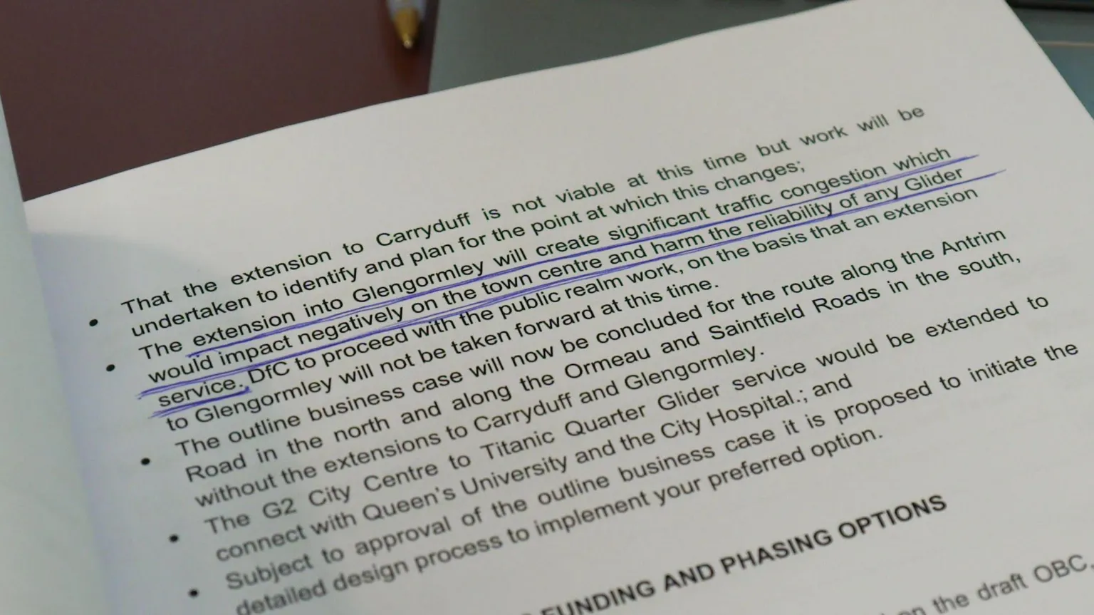 An image showing a page of a briefing paper on proposals to extend the Glider service to Glengormley, with a sentence highlighted that reads: 