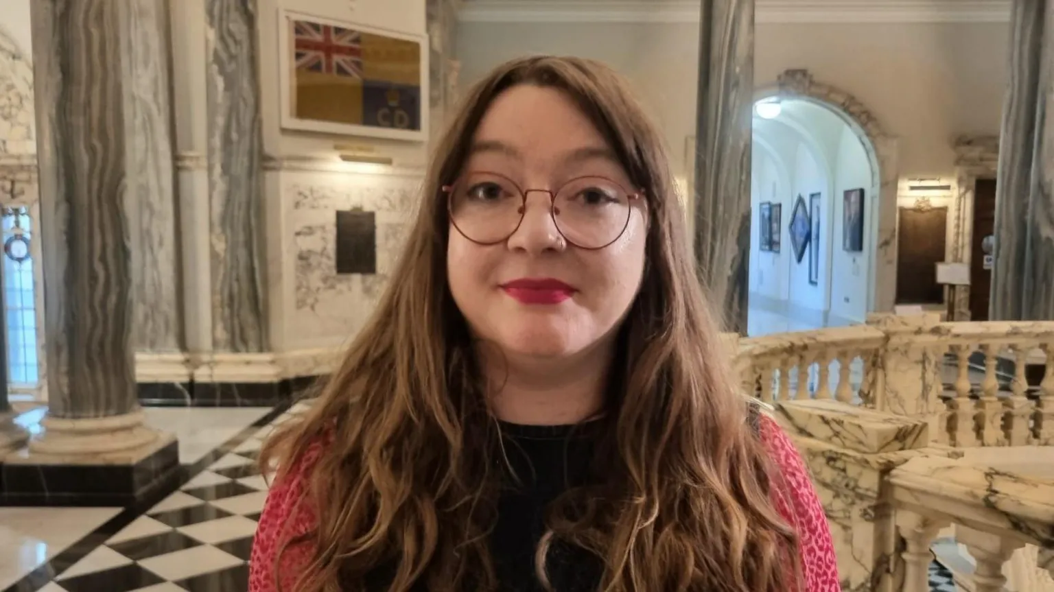 Green Party councillor Áine Groogan pictured inside Belfast City Hall