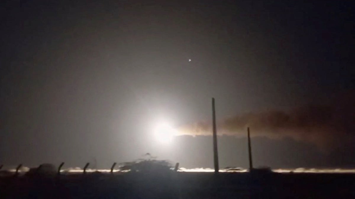 A still image from a video showing a missile travelling across a night sky.