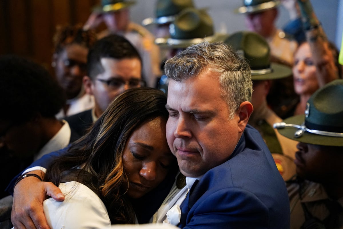 Democratic Senator London Lamar of Memphis and Democratic Tennessee State Representative Jason Powell embrace on the day of the passage of the new congressional map.