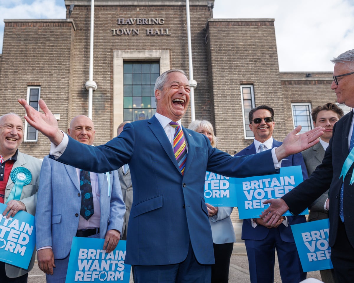 Nigel Farage poses with Reform councillors outside Havering town hall 