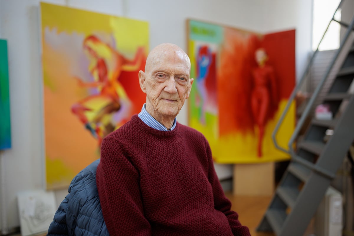 Allen Jones in his studio in Oxfordshire with paintings in the background
