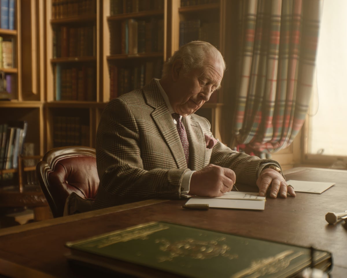 King Charles writes his card