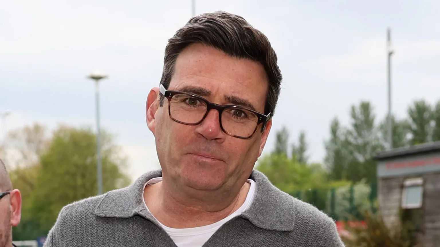  Andy Burnham in a grey sweater and white T-shirt arriving for a charity football match