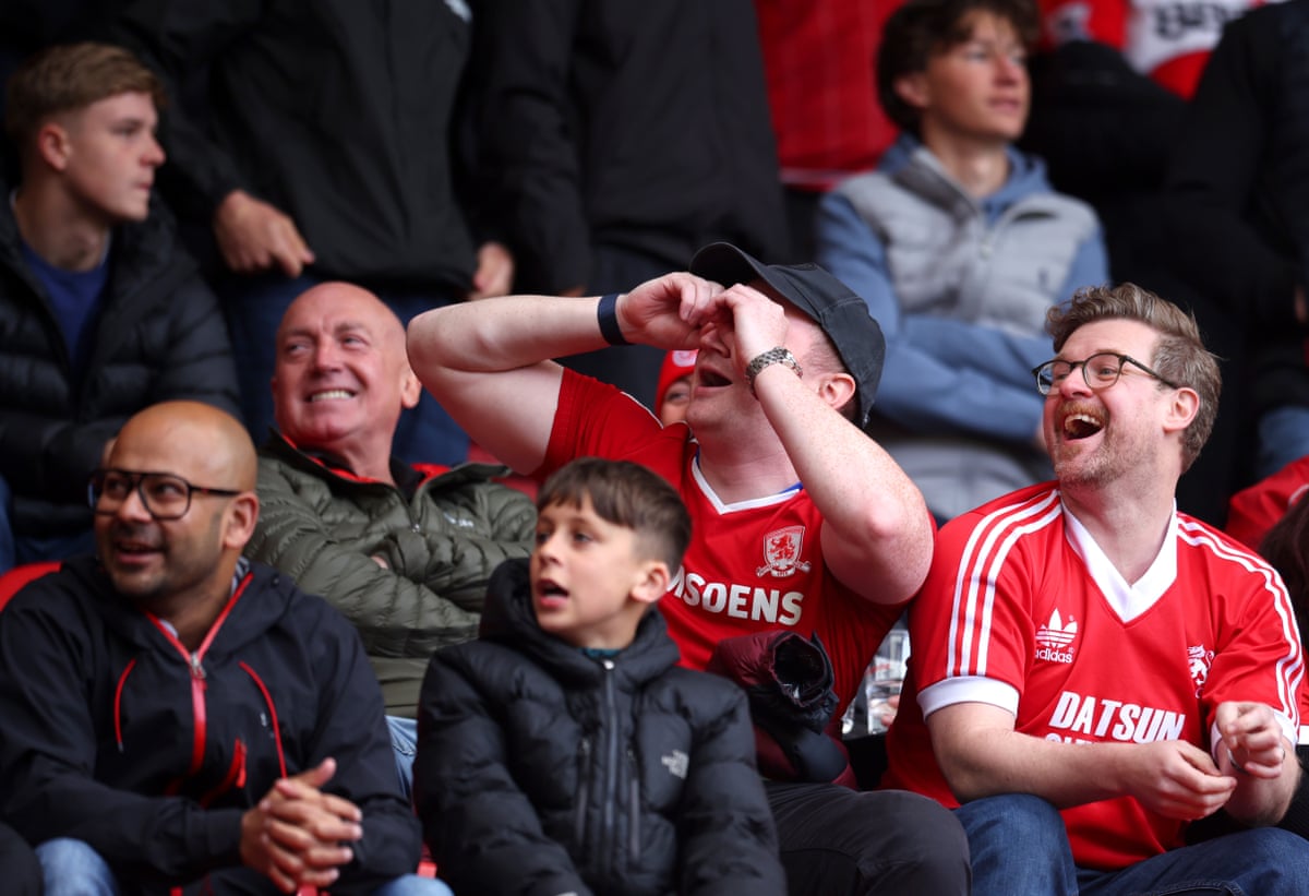 Middlesbrough fans mimicking spying.