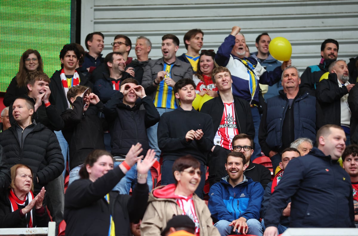 Southampton fans mimicking spying.