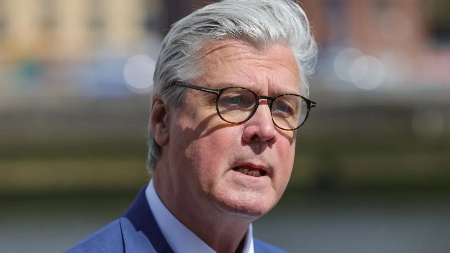  Malcolm Offord, who has grey hair and glasses, in a close-up shot 