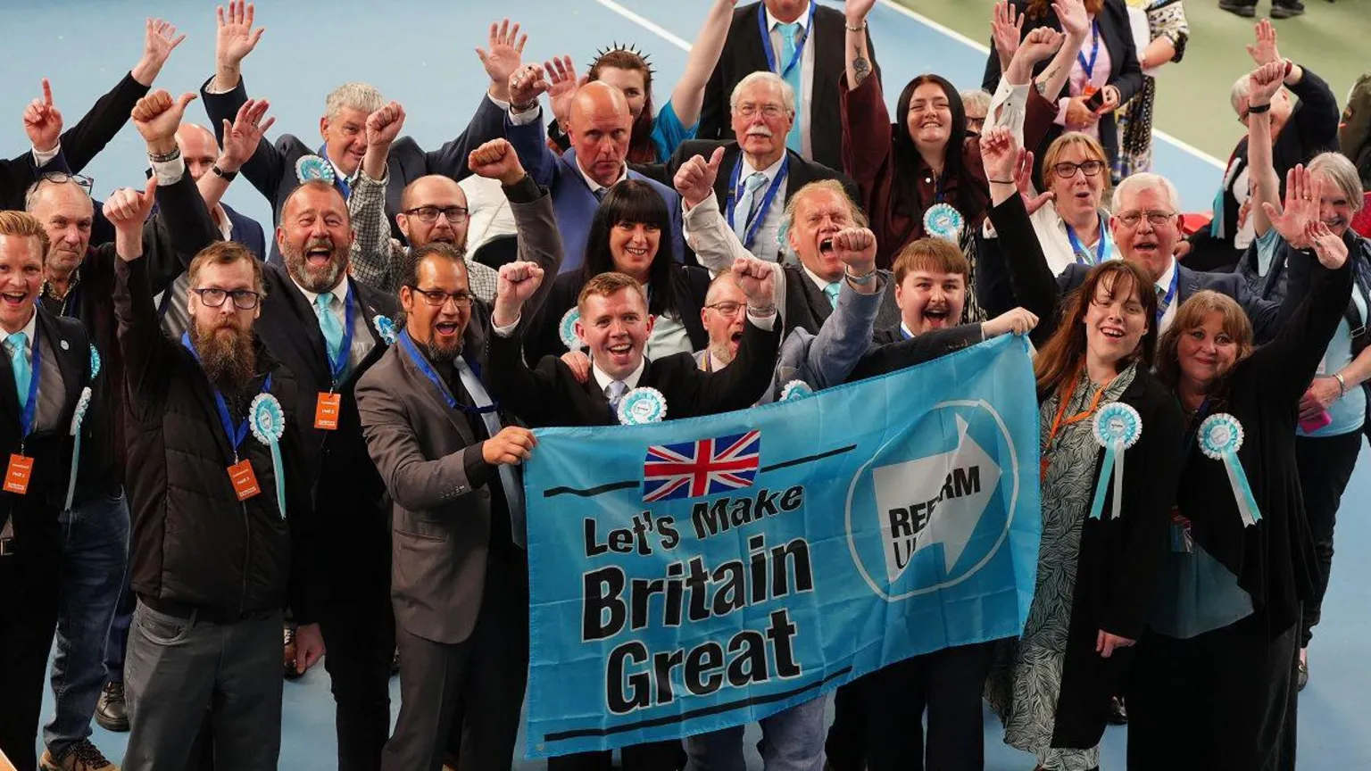  Reform UK supporters celebrate during the 2026 local election count at the Silksworth Sports Complex in Sunderland. Picture date: Friday May 8, 2026. PA Photo.