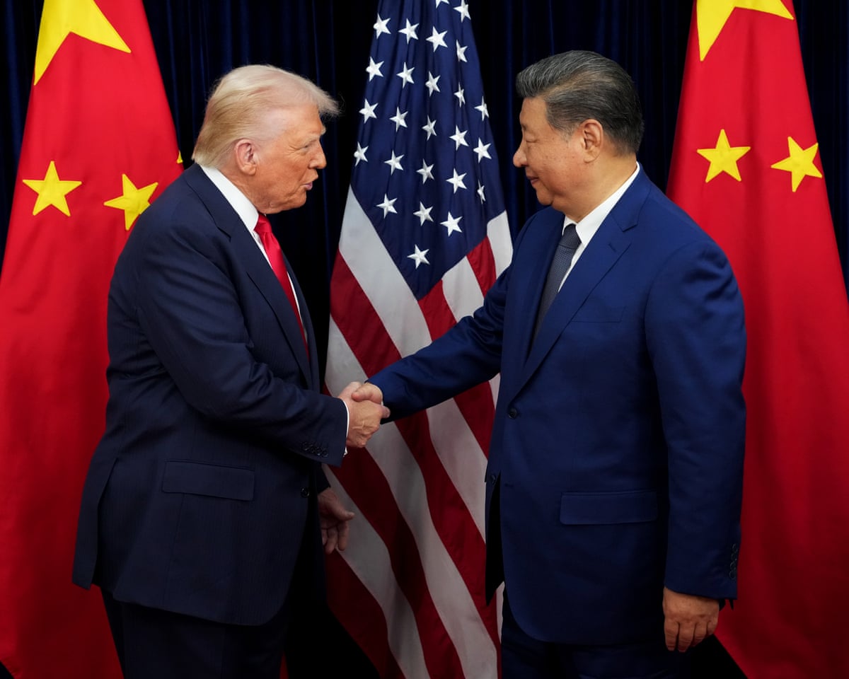 President Donald Trump greets Chinese President Xi Jinping ahead of a bilateral meeting at Gimhae Air Base on October 30, 2025 in Busan, South Korea.