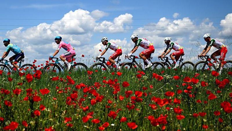 Guillermo Thomas Silva, second left, remains in pink after the peloton arrived in Sofia