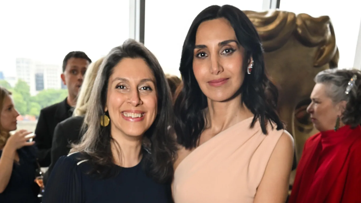 Nazanin Zaghari-Ratcliffe posing and smiling with Narges Rashidi