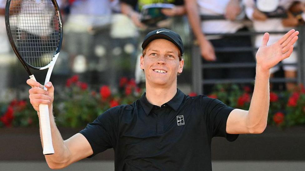Jannik Sinner celebrates beating Alexei Popyrin