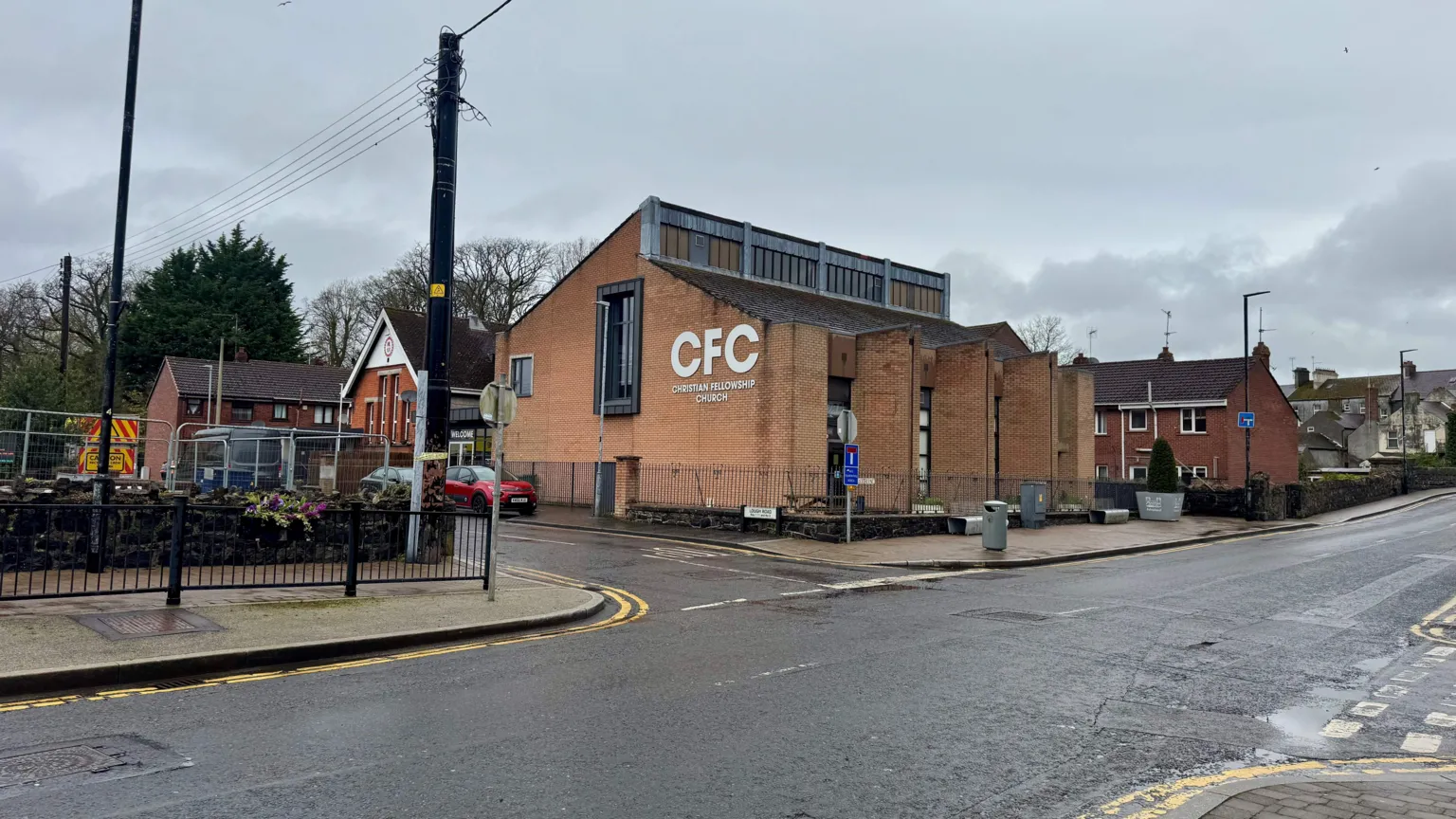 An image of a brick building this is occupied by a church, just behind the building you can see the Royal British Legion club