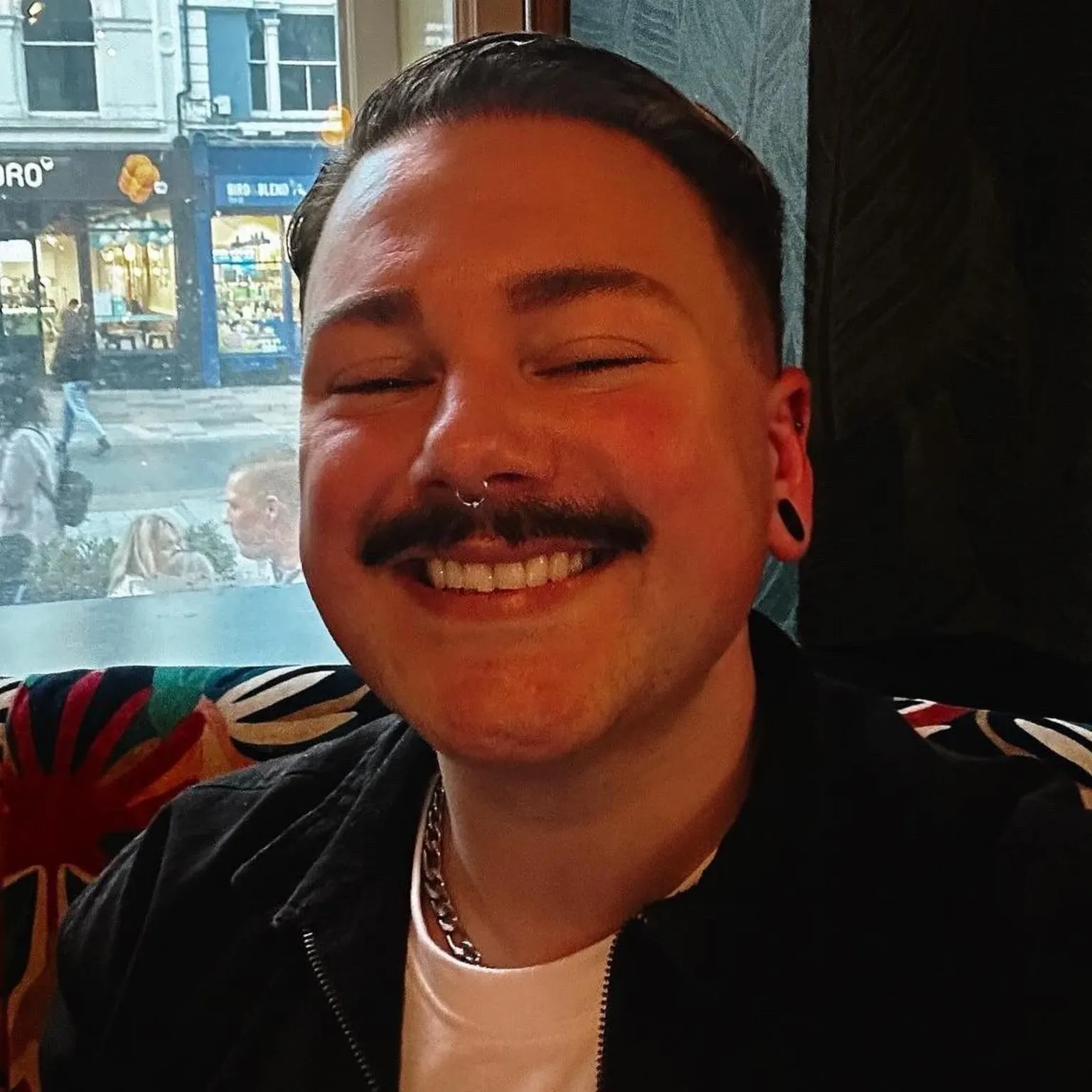 Lloyd Best Lloyd Best, who has dark hair and a moustache and a nose ring, smiles at the camera