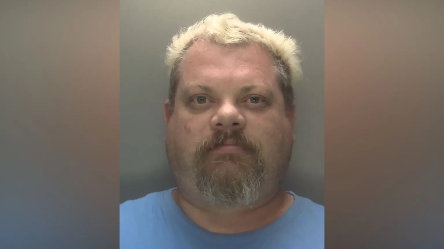 Leicestershire Police A police mugshot of James Siddell. He is wearing a blue t-shirt and has short bleach blonde hair.