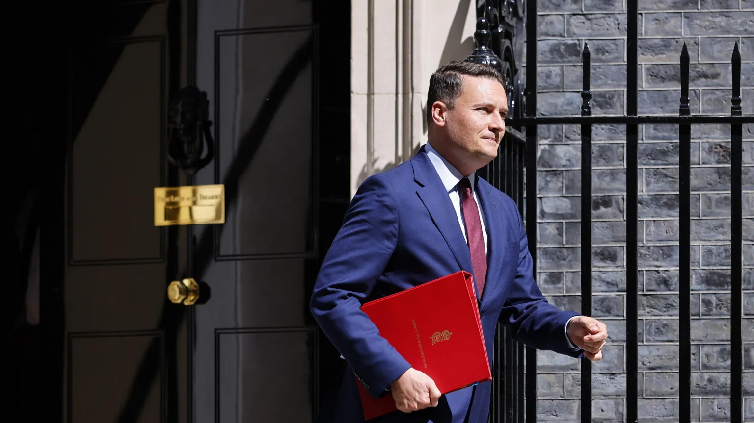 EPA Wes Streeting leaving 10 Downing Street with a red folder tucked under his arm