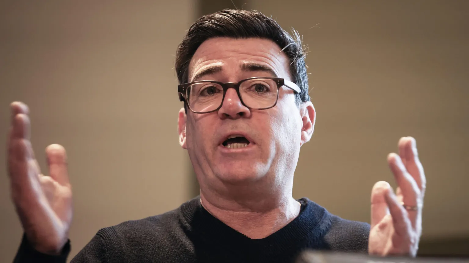 Andy Burnham in a dark jumper.
