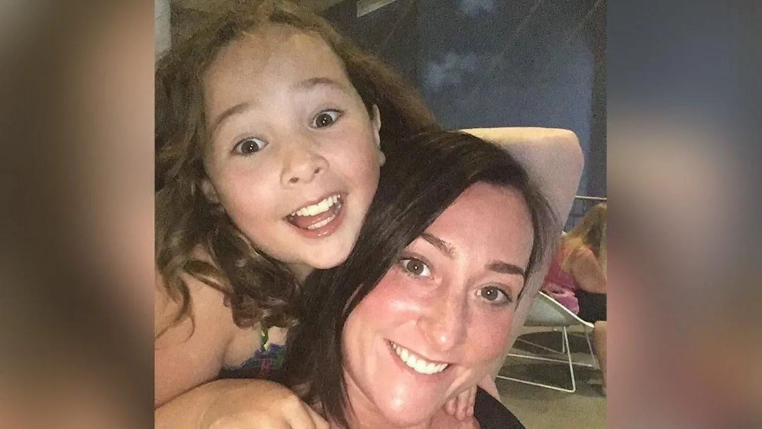 Kimberly Darroch Ten-year-old Milly Main has brown, curly hair and has a big open-mouth smile. She is holding on to her mother Kimberly Darroch's back. Kimberly has dark brown hair and is smiling at the camera.