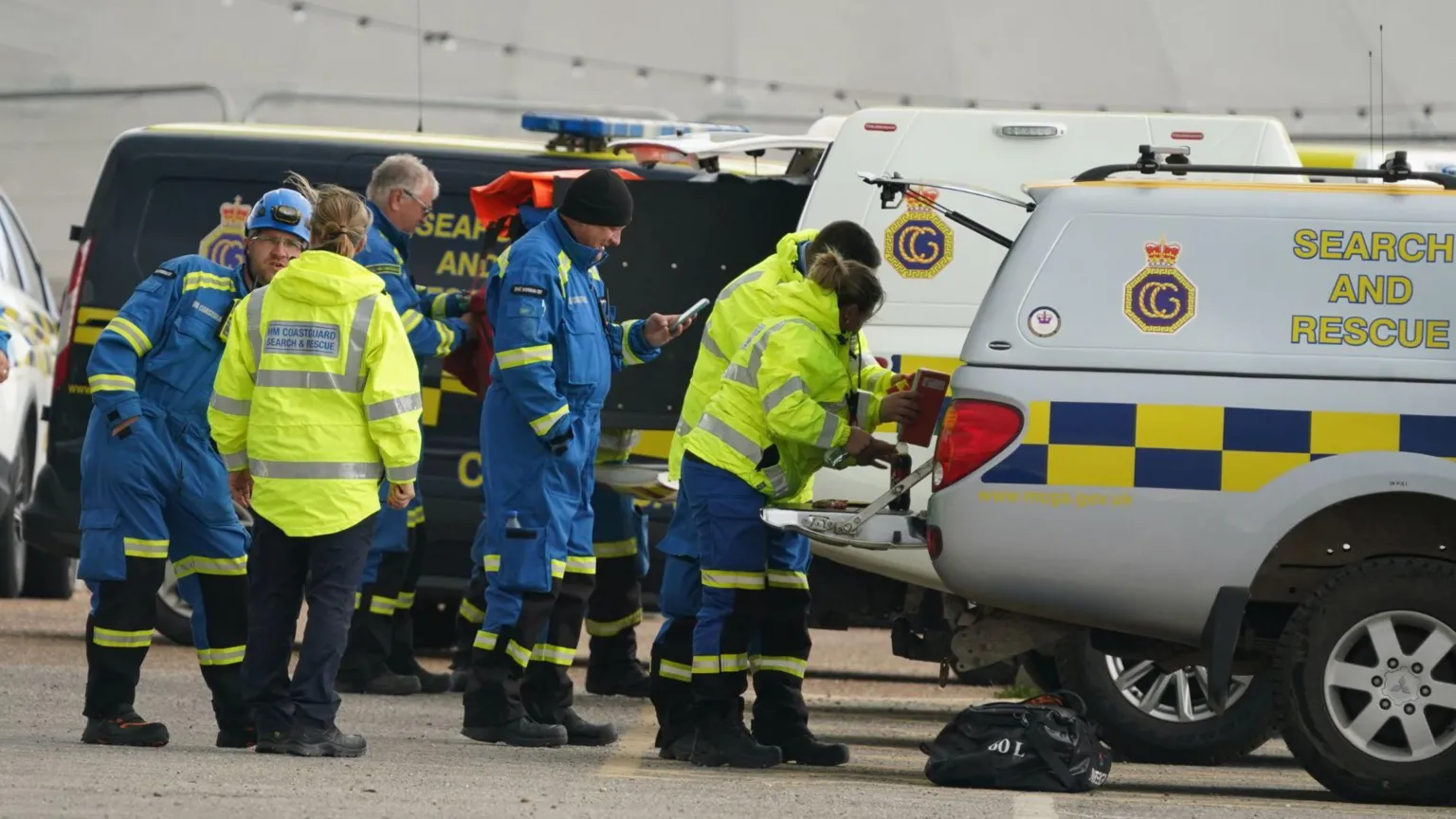 Half a dozen coastguard crews working in the back of search and rescue vehicles