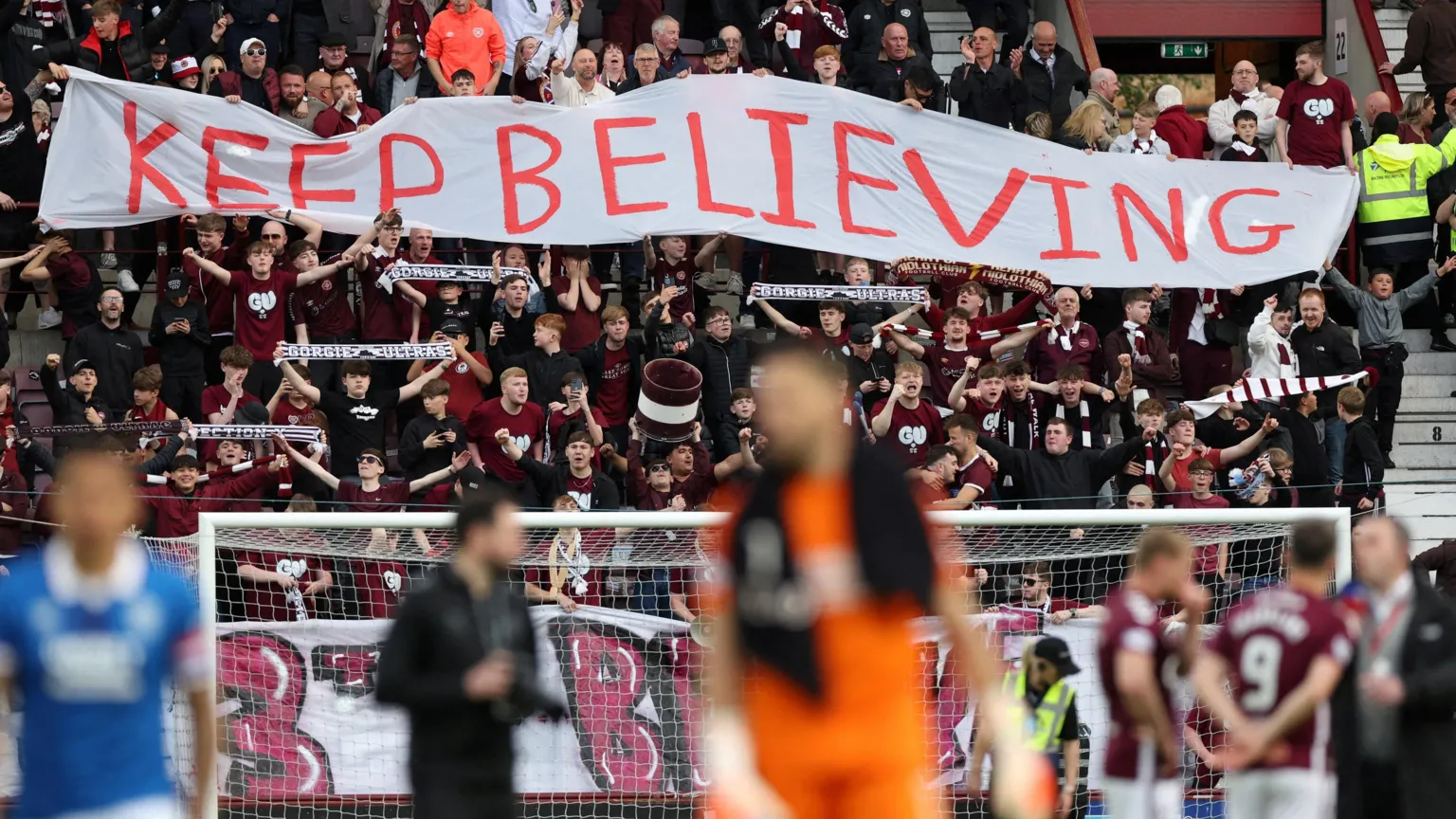 Hearts fans display a banner reading
