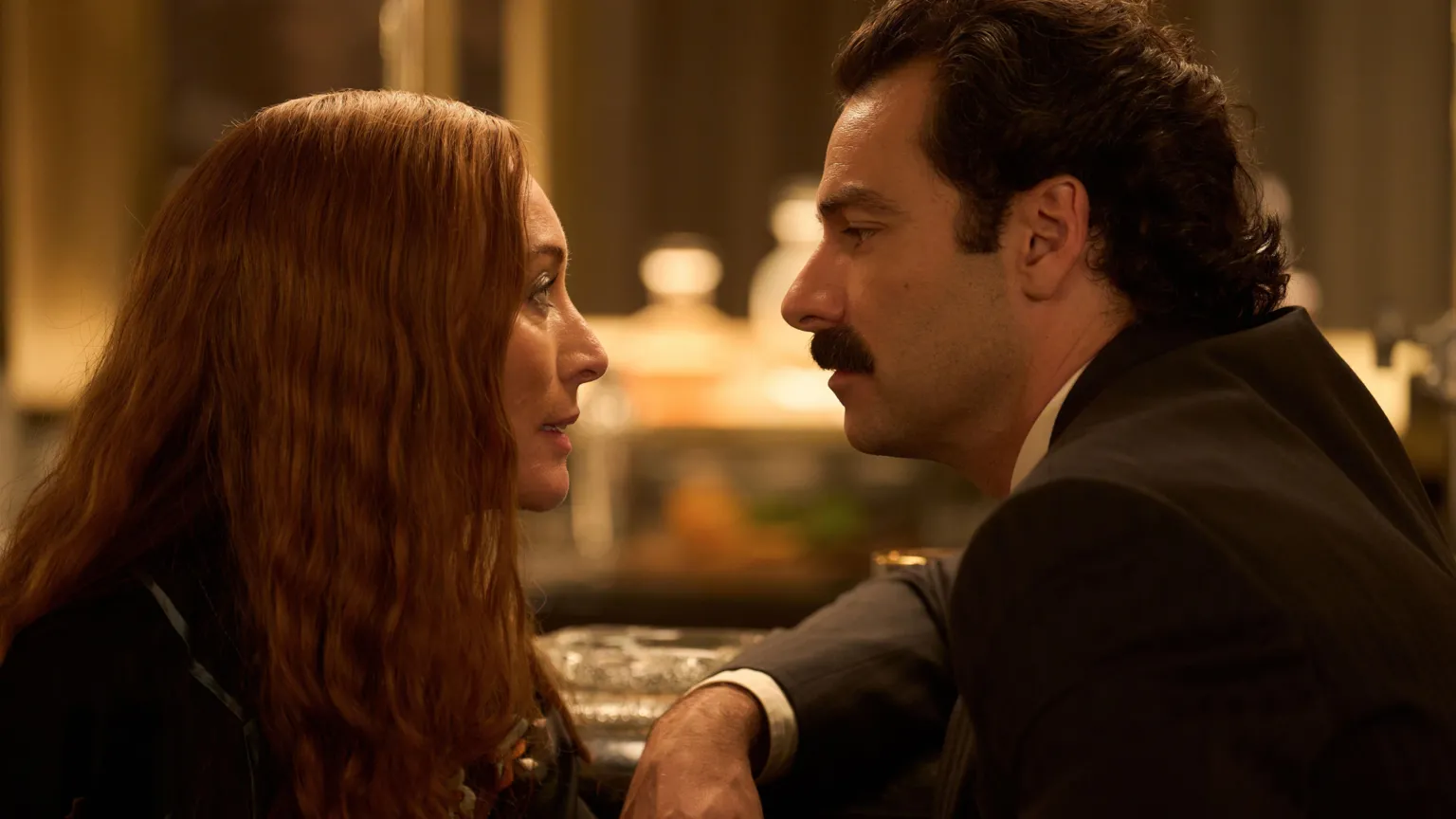 Robert Viglasky/Disney Victoria Smurfit and Aidan Turner facing each other in formal dress 