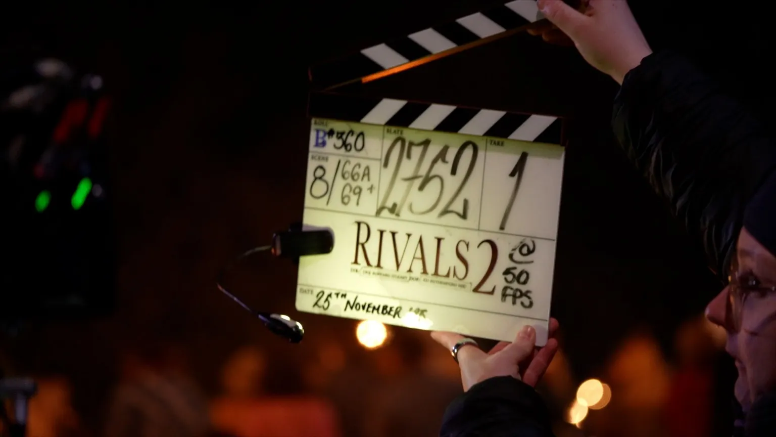 Julius Peacock/BBC A closeup of the clapper, which has 'Rivals 2' written on it, and then lots of other numbers to do with the scene and date, which says 25 November.
