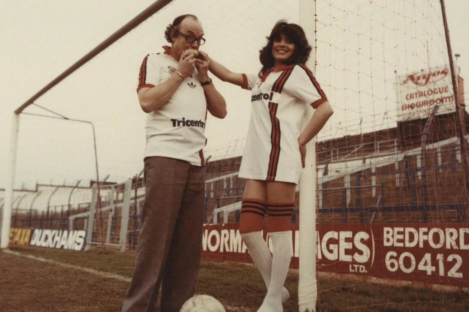 Hatters Heritage Eric Morecambe with model Jackie Jones wearing the club's 1980 kit at Kenilworth Road