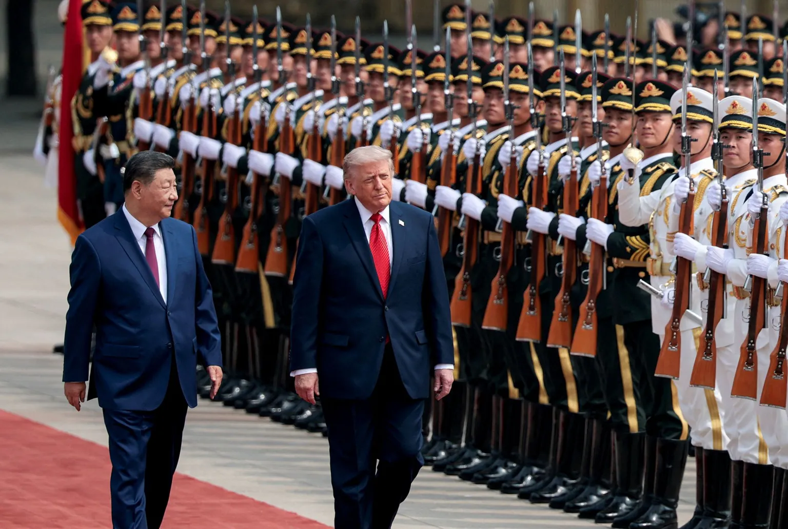 U.S. President Donald Trump inspects an honour guard during a welcome ceremony with Chinese President Xi Jinping at the Great Hall of the People in Beijing, China, May 14, 2026