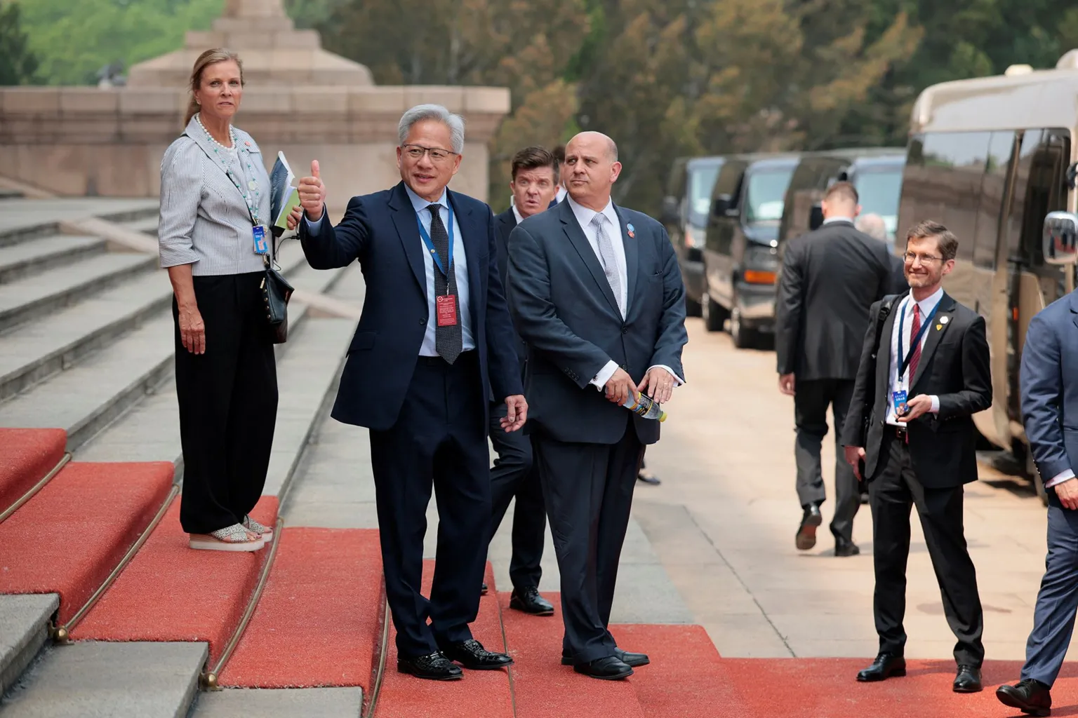 Jensen Huang, Founder, President and CEO of Nvidia gestures as he leaves after attending a welcome ceremony for U.S. President Donald Trump with Chinese President Xi Jinping at the Great Hall of the People in Beijing, China, May 14, 2026.
