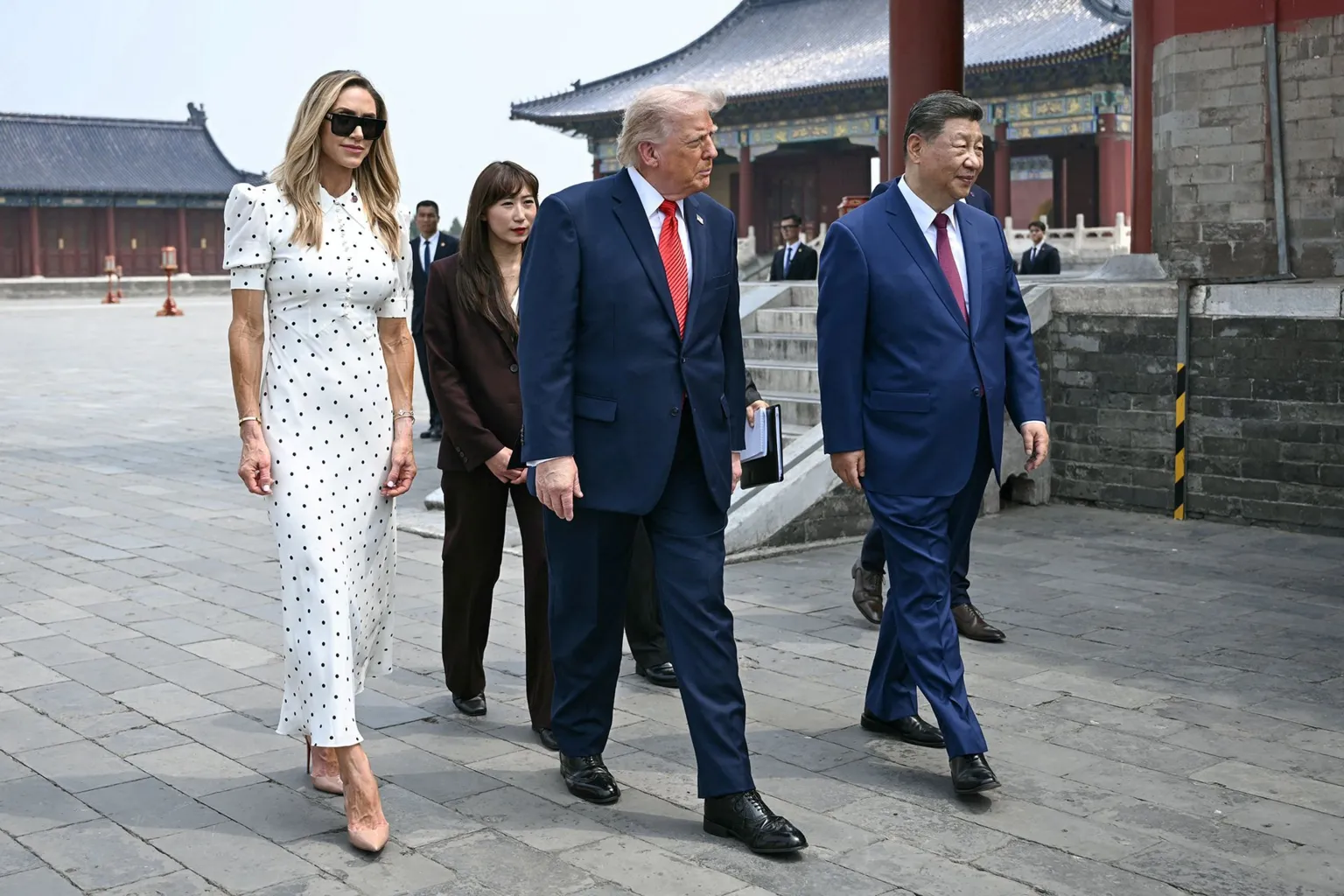 China's President Xi Jinping (R) and US President Donald Trump (C) visit the Temple of Heaven in Beijing on May 14, 2026.