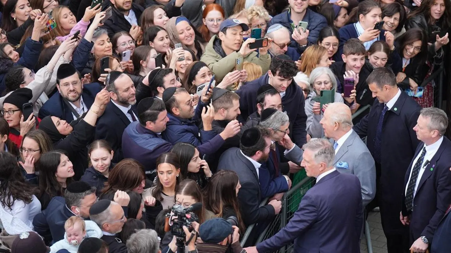 The King meets a large crowd of well-wishers during his visit
