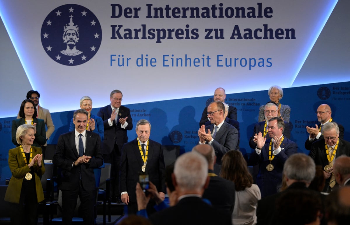 The former President of the European Central Bank and former Italian prime minister Mario Draghi is applauded by the president of the European Commission Ursula von der Leyen, Greek prime minister Kyriakos Mitsotakis and German chancellor Friedrich Merz as he is awarded the 2026 International Charlemagne Prize in Aachen, Germany.