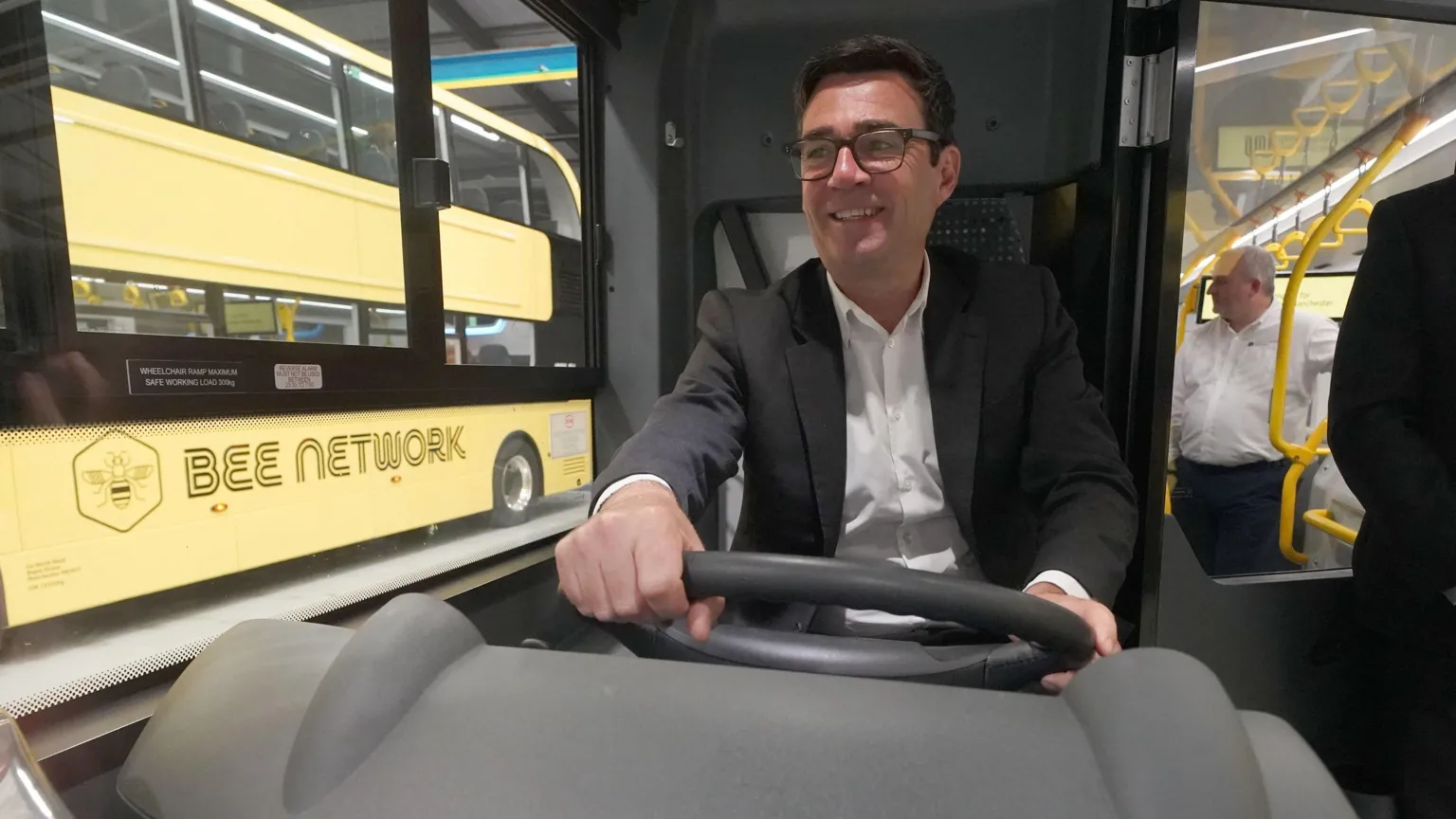  Andy Burnham drives a yellow 