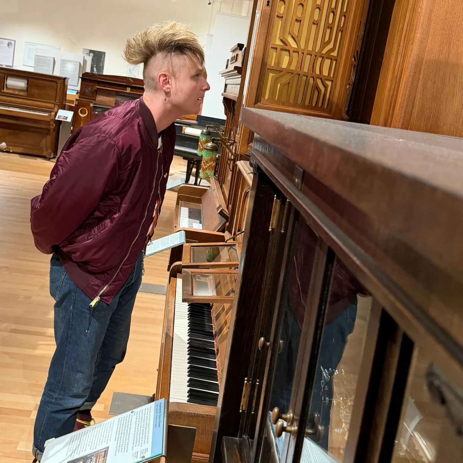 Sam Battle stares at a mechanical piano inside Vienna's Museum of Science and Technology