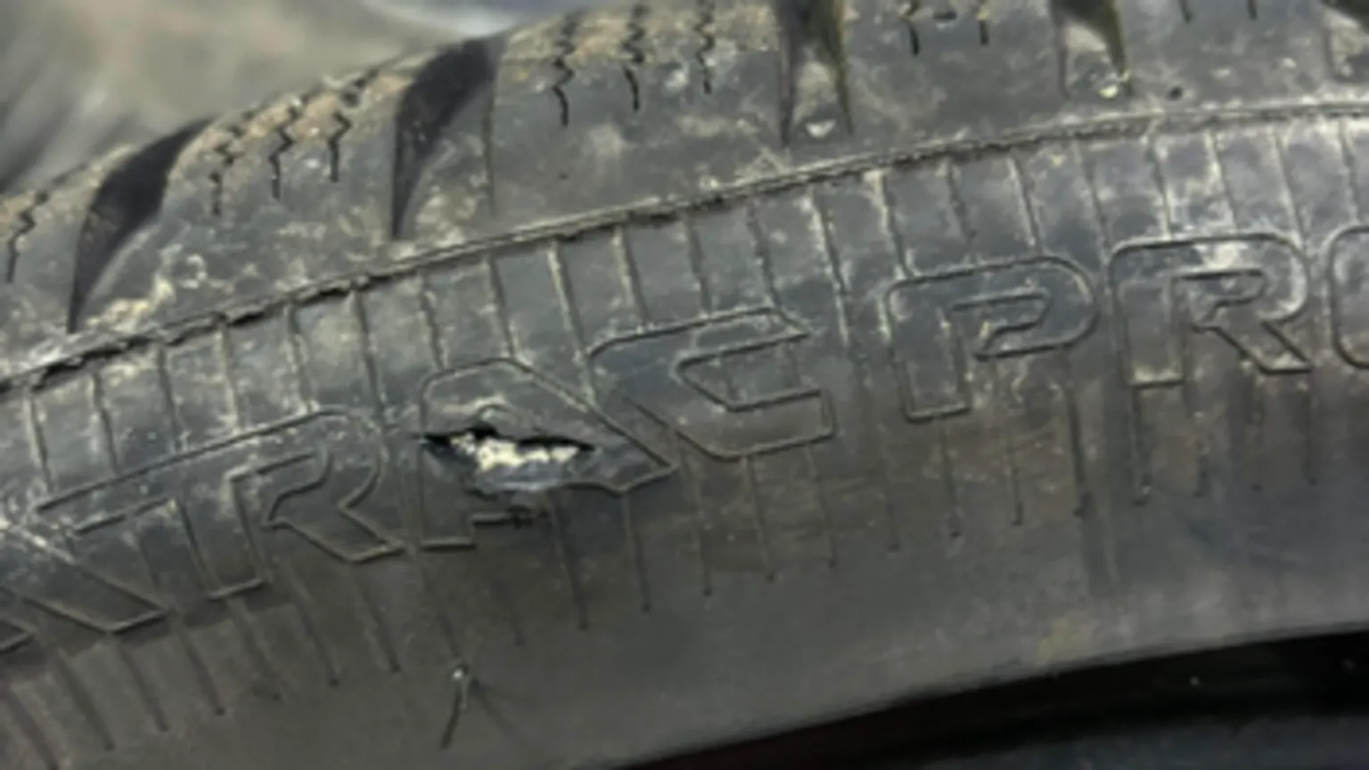 Marie McCallum A black car tyre has a hole in it caused by a pothole 