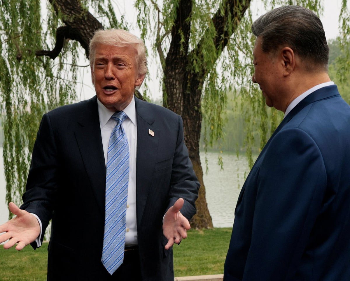Donald Trump as Xi Jinping greets him at the Zhongnanhai garden in Beijing on Friday