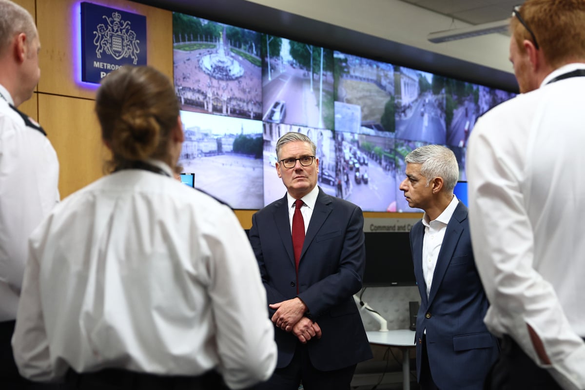 Prime minister Keir Starmer and London mayor Sadiq Khan speaking with police officers.