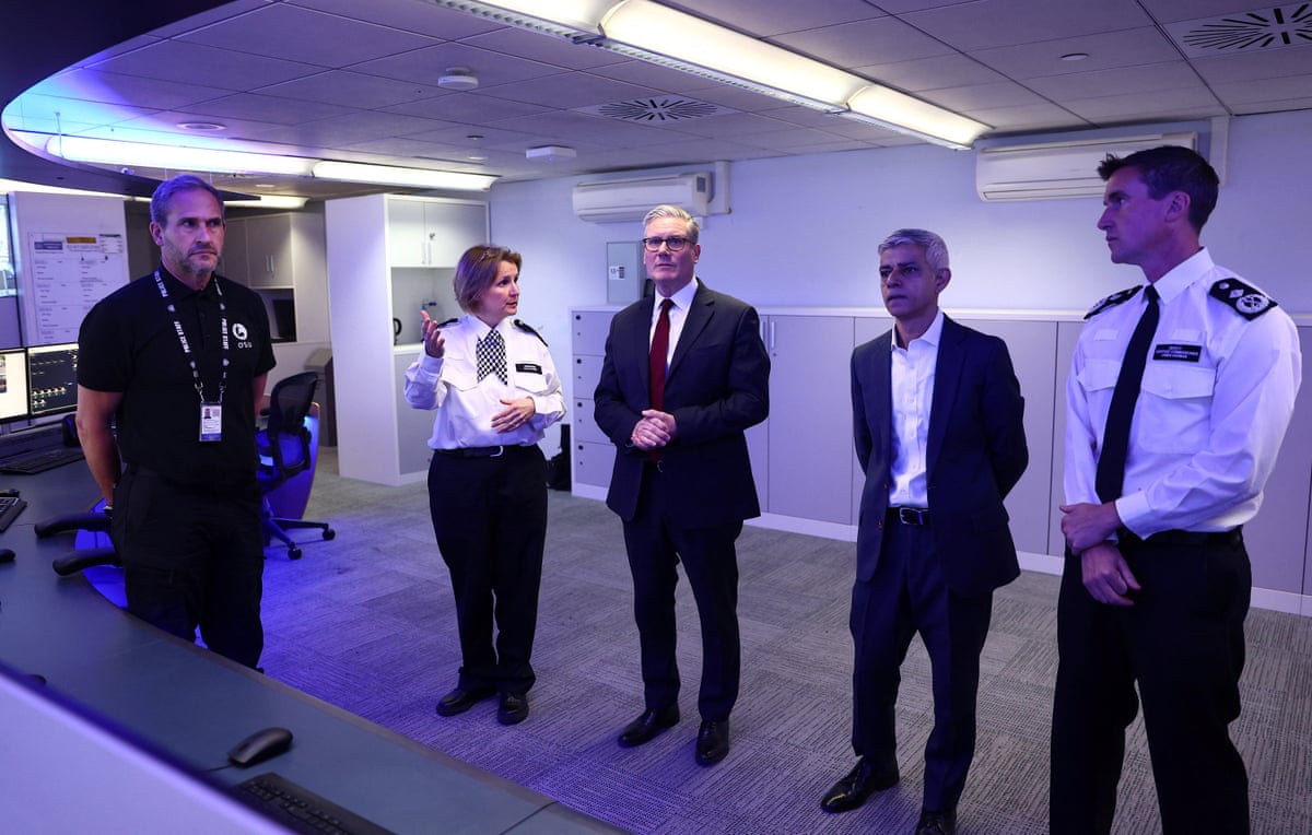 Starmer and Khan with commander Clair Haynes and deputy assistant commissioner James Harman as they speak with members of the police.