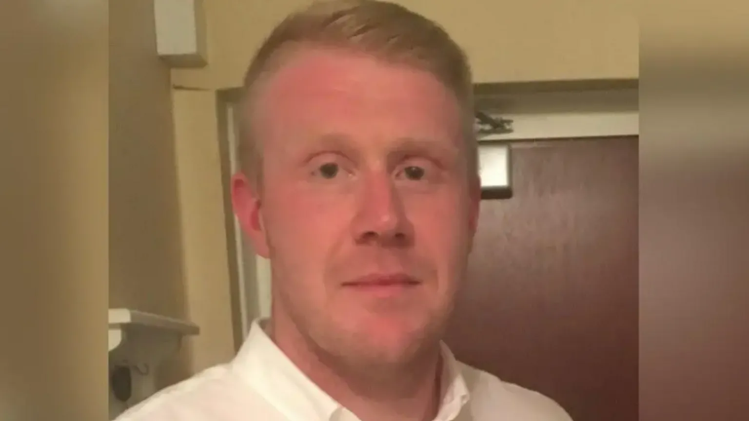 Devon & Cornwall Police Close-up image of Danny Cahalane. He is wearing a white shirt and is looking into the camera.