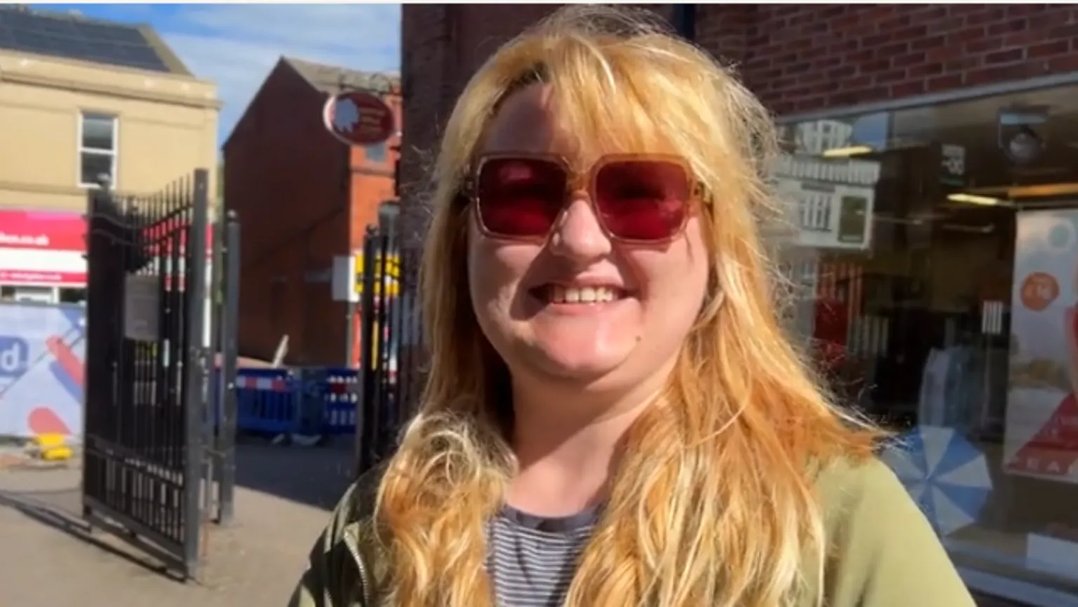 Gabriel Parkinson is smiling, looking at the camera. She is wearing sunglasses.