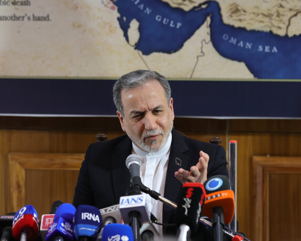 Iran’s foreign minister, Abbas Araghchi,, speaks at a press conference in New Delhion Friday with a map showing the strait of Hormuz in the background