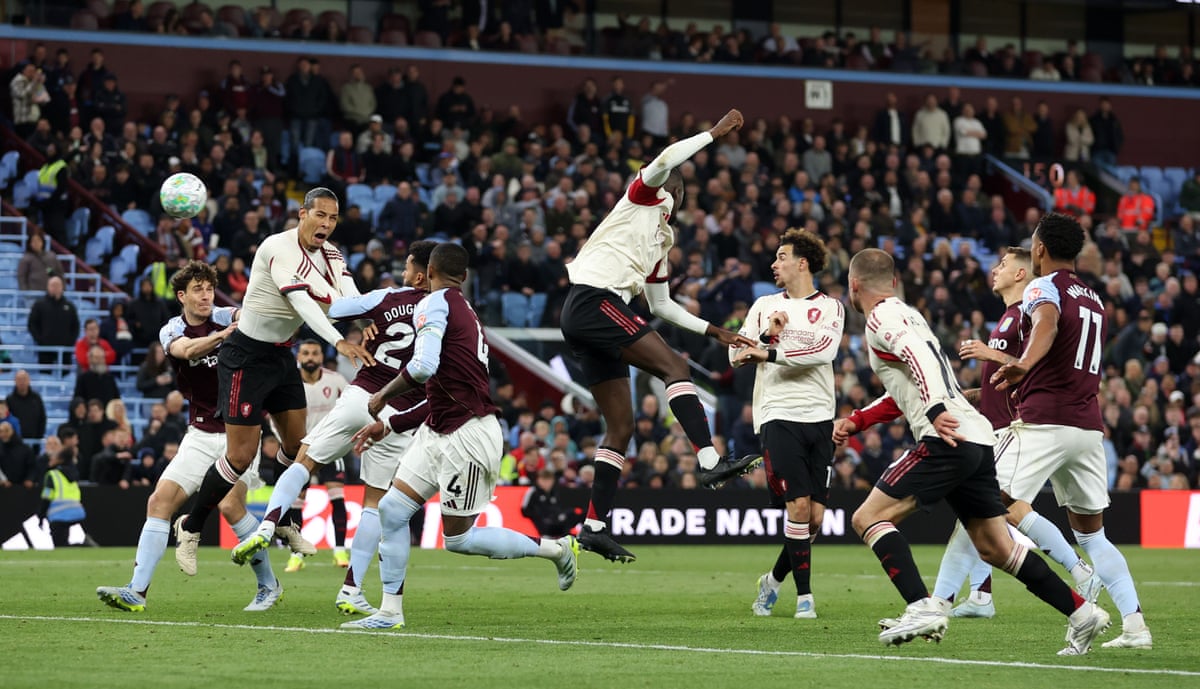 Virgil van Dijk of Liverpool (second left) heads home for the second time in the match.