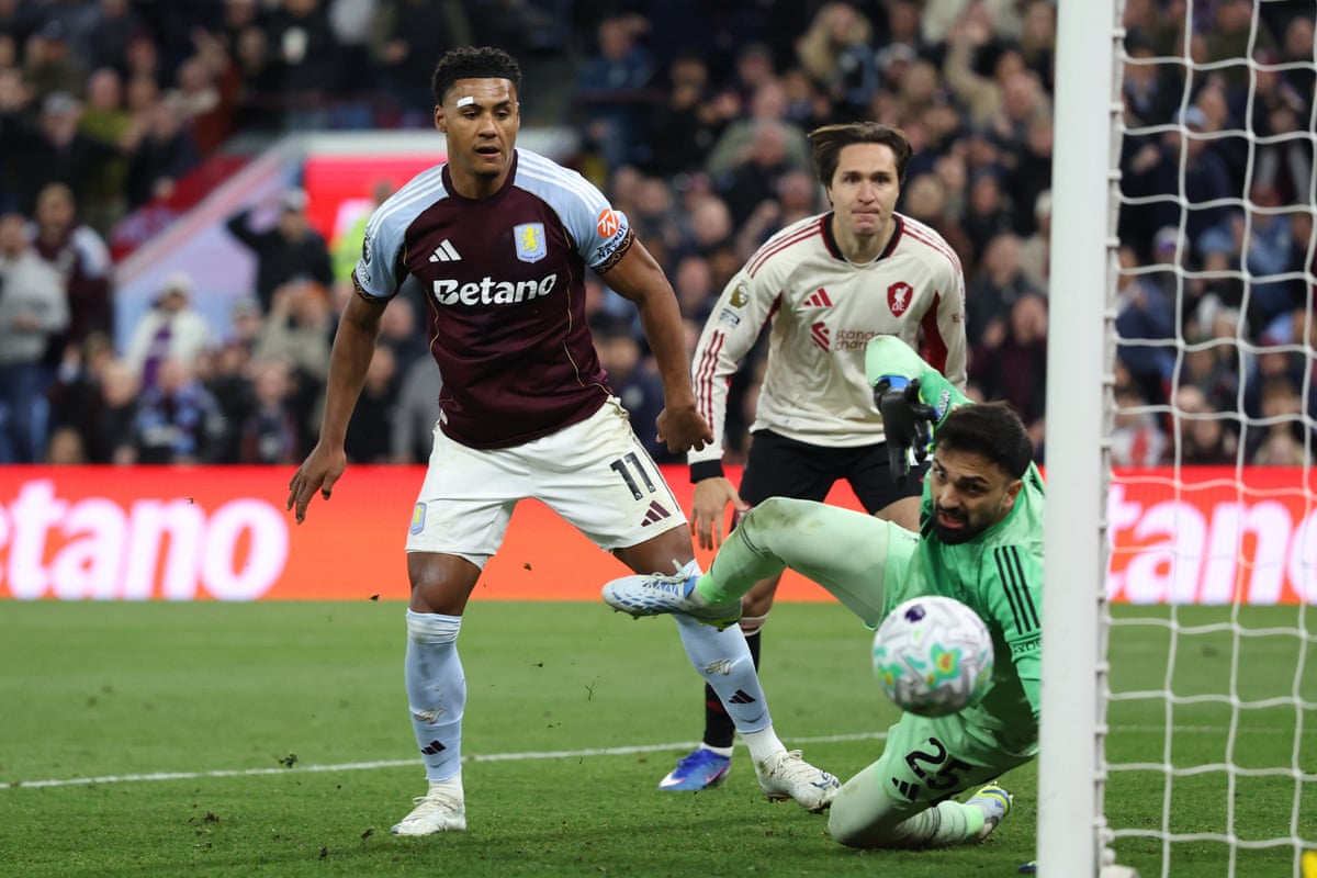 Ollie Watkins watches his shot beat Liverpool's keeper Giorgi Mamardashvili for his second, and Aston Villa’s third, goal against Liverpool.