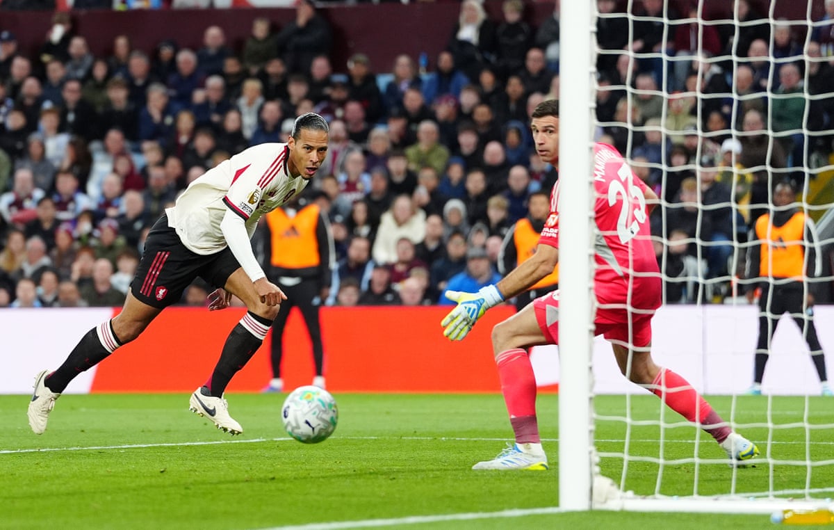 Virgil van Dijk of Liverpool scores a goal to make the score 1-1 at Aston Villa.
