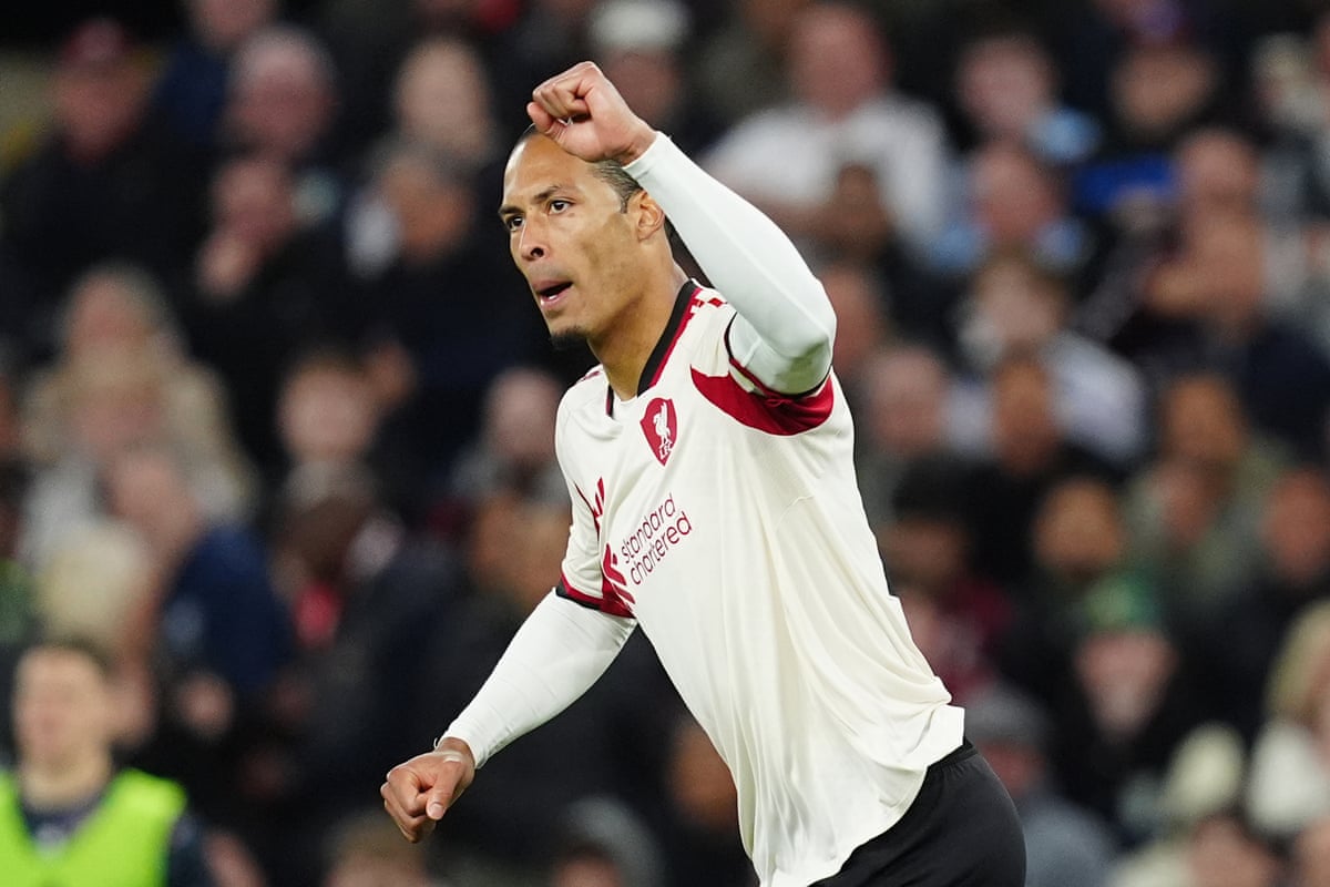 Liverpool's Virgil van Dijk celebrates scoring their side's first goal after a VAR check.