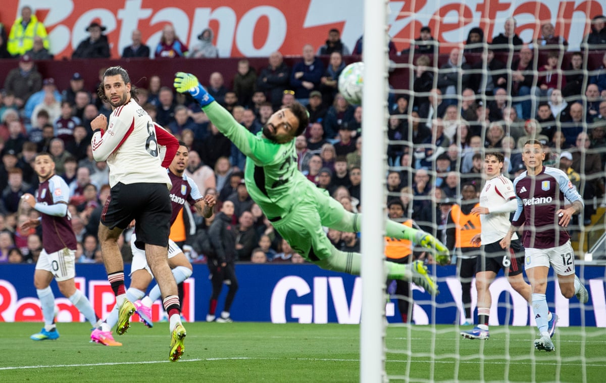 Morgan Rogers (third left, partially hidden) curls a shot past Liverpool keeper Giorgi Mamardashvili give Aston Villa the lead.