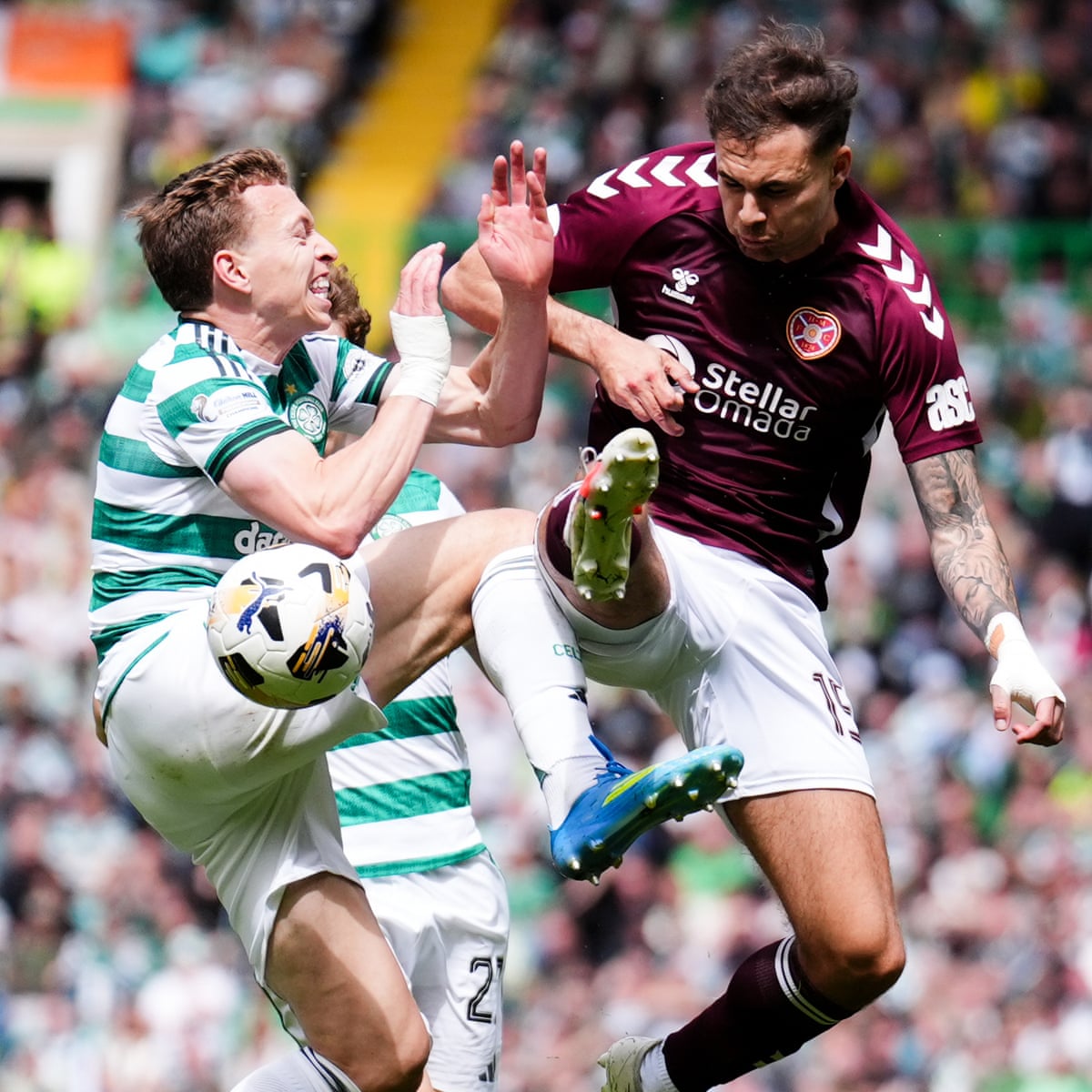 Hearts' Michael Steinwender and Celtic's Alistair Johnston battle for the ball.