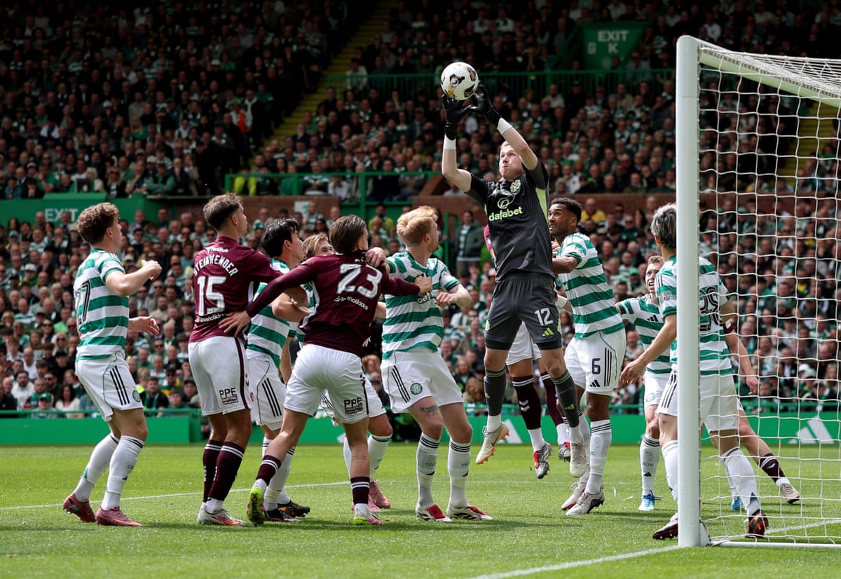 Celtic's keeper Viljami Sinisalo plucks the ball out of the air.