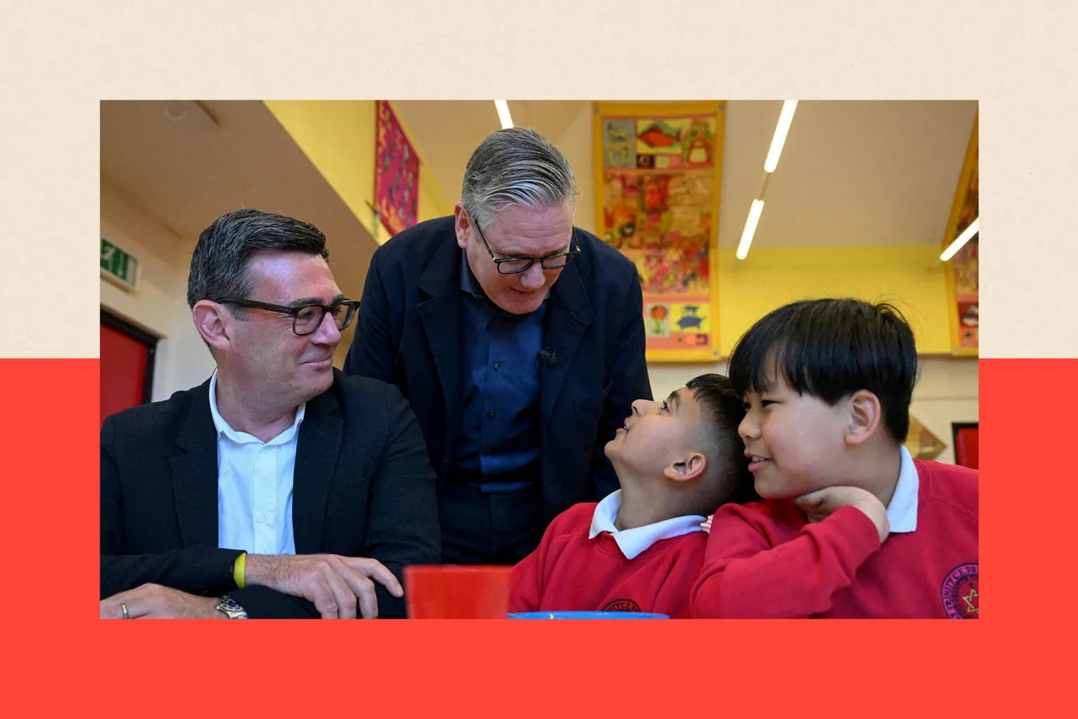 Britain's Prime Minister Keir Starmer meets school children at a breakfast club with Greater Manchester Mayor Andy Burnham