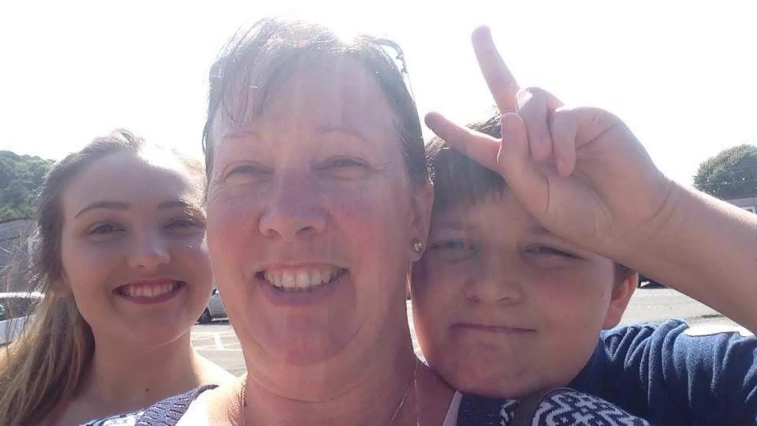 Chloe Cooper Selfie of Chloe with Cheryl and Ethan on a sunny day. All three are smiling looking at the camera.